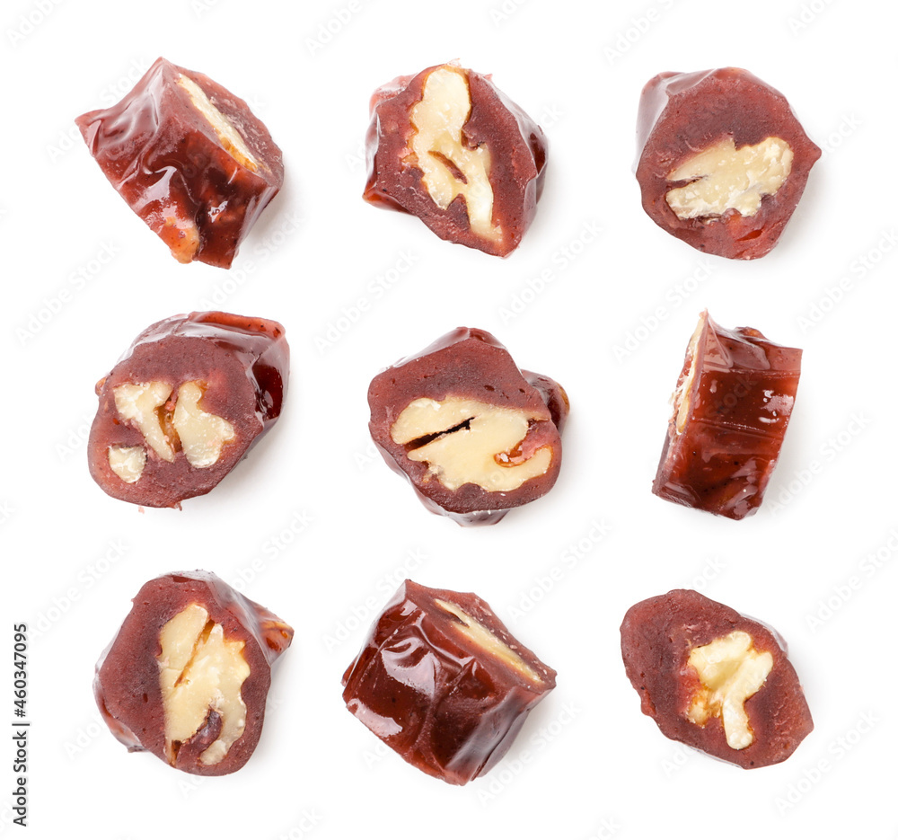Set of pieces of churchkhela on a white background, isolated. Top view Set of pieces of churchkhela on a white background, isolated. Top view