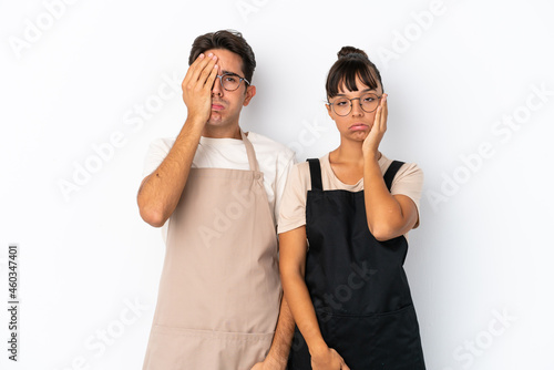 Restaurant mixed race waiters isolated on white background with surprise and shocked facial expression