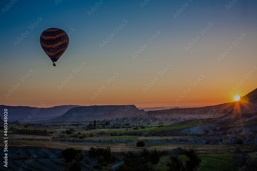Hot air balloons flying over the valley at Cappadocia, Turkey. G Hot air balloons flying over the valley at Cappadocia, Turkey. G