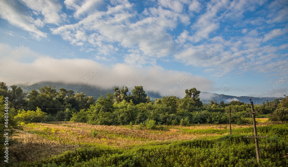 Mountain valley during sunrise. Natural summer landscape. View f Mountain valley during sunrise. Natural summer landscape. View f