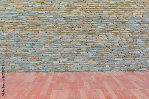 Wall stone texture closeup background texture with red tiles