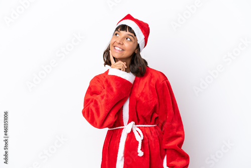 Young mixed race woman disguised as Santa Claus isolated on white background thinking an idea while looking up