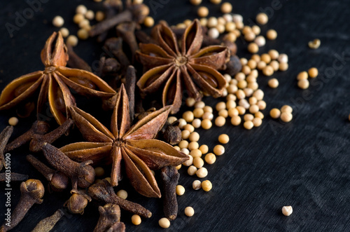 Macro Image of Clove,Star Anise and Mustard Seeds on Black Background