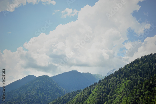 Clouds in the green peaks of the mountains. Abkhazia, the country of the soul
