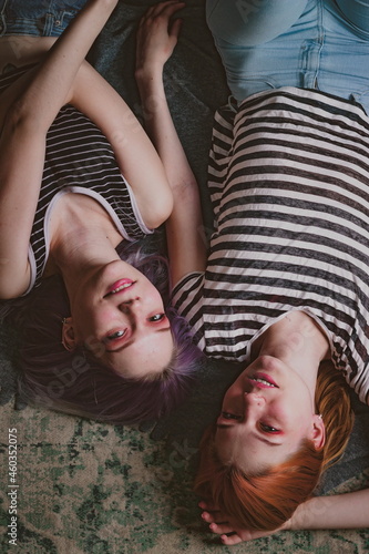 twins in striped t-shirts lie
