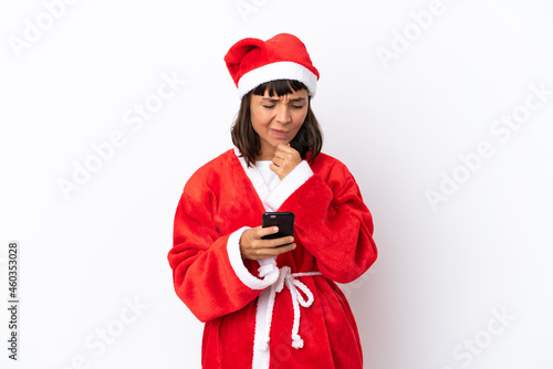 Young mixed race woman disguised as Santa Claus isolated on white background thinking and sending a message