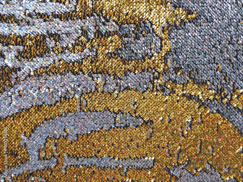 Background or texture of holographic golden and silver sequins