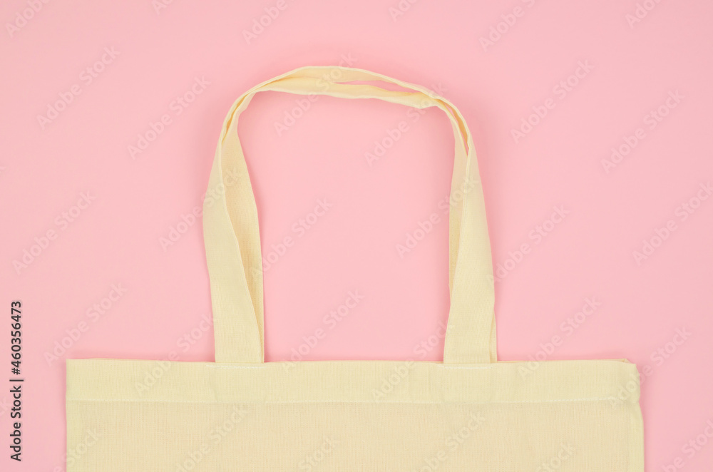Linen shopping bag on a pink background with place for text. Environmentally friendly materials Linen shopping bag on a pink background with place for text. Environmentally friendly materials