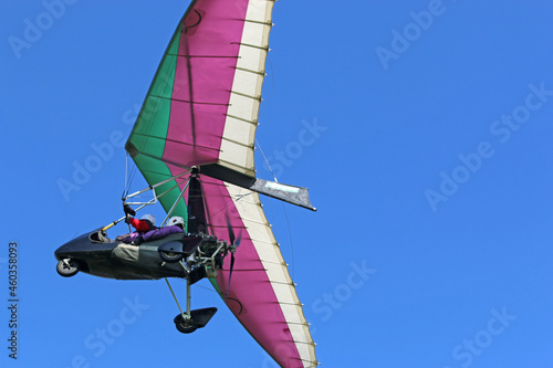 Valokuva Ultralight airplane flying in a blue sky