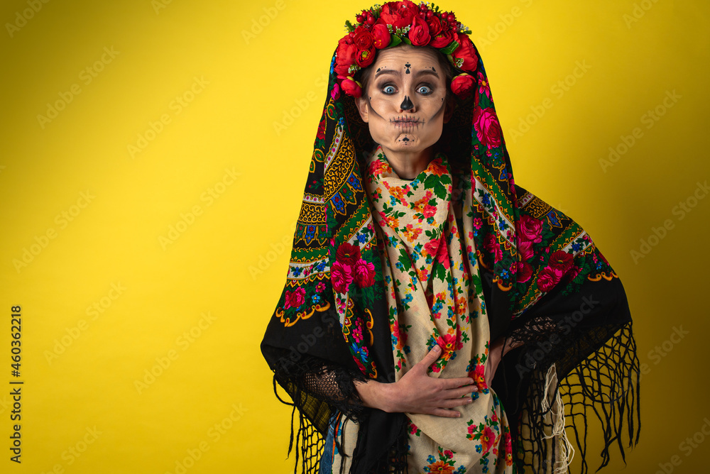 girl in the image of Kalavera Katrina close up showing various emotional body gestures, in a headscarf, on a yellow background. Dia-de -los -muertos. Day of death. Halloween. girl in the image of Kalavera Katrina close up showing various emotional body gestures, in a headscarf, on a yellow background. Dia-de -los -muertos. Day of death. Halloween.