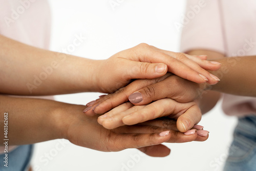 Different ethnicity female hands. Multicultural diversity and friendship.