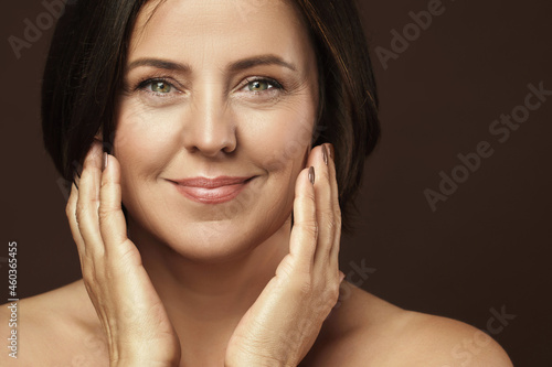Beautiful middle aged woman with clean wrinkled skin