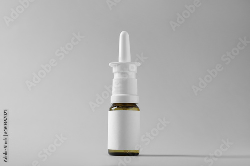 Obraz na plátne Bottle of nasal spray on grey background
