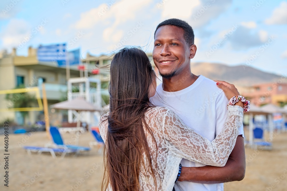 Obraz premium Happy young couple hugging, man's face close up