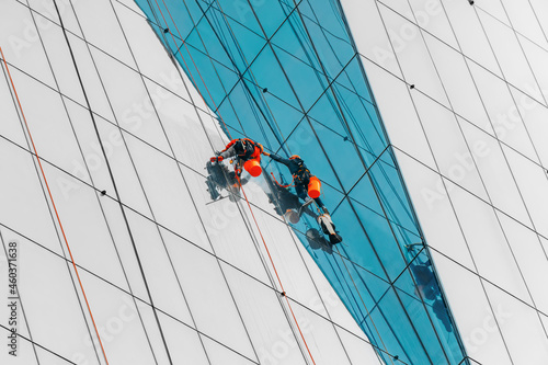 Canvas Print Rope access technicians cleaning windows on commercial high-rise buildings