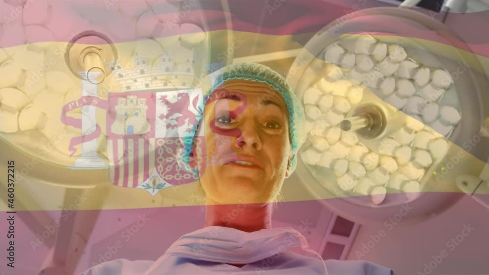 Animation of flag of spain waving over anesthesiologist in operating theatre Animation of flag of spain waving over anesthesiologist in operating theatre