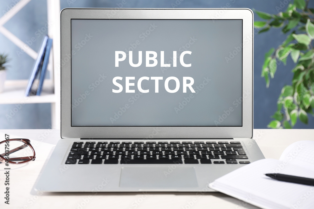 Public Sector. Modern laptop on table in office Public Sector. Modern laptop on table in office