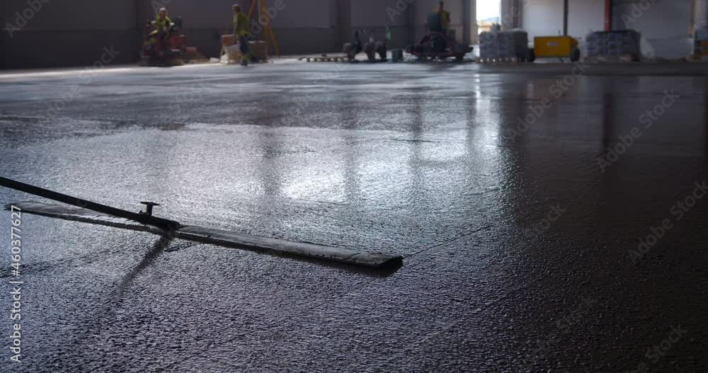 At a construction site in a under construction, a worker