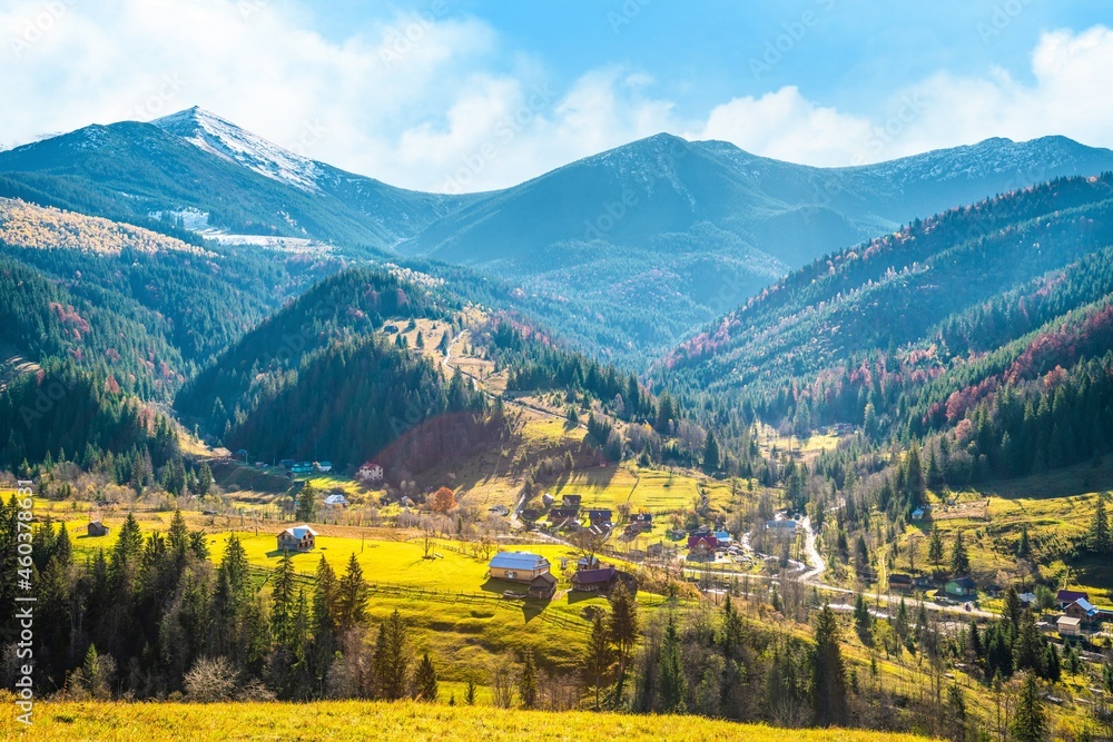 Beautiful forests covering the Carpathian mountains and a small village