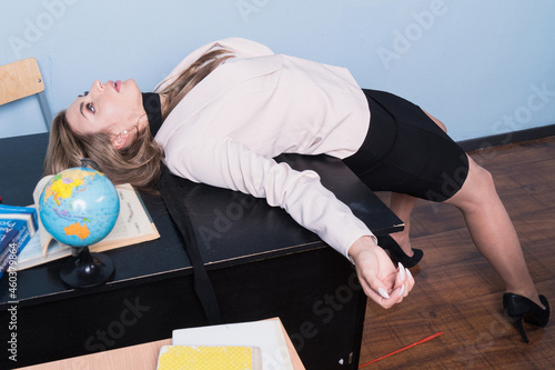 Crime scene (imitation). Strangled teacher in the classroom...