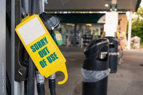 Sorry Out of Use sign on a pump in England as fuel shortage hits the country. People waiting in lines to get any petrol, crisis in the whole country