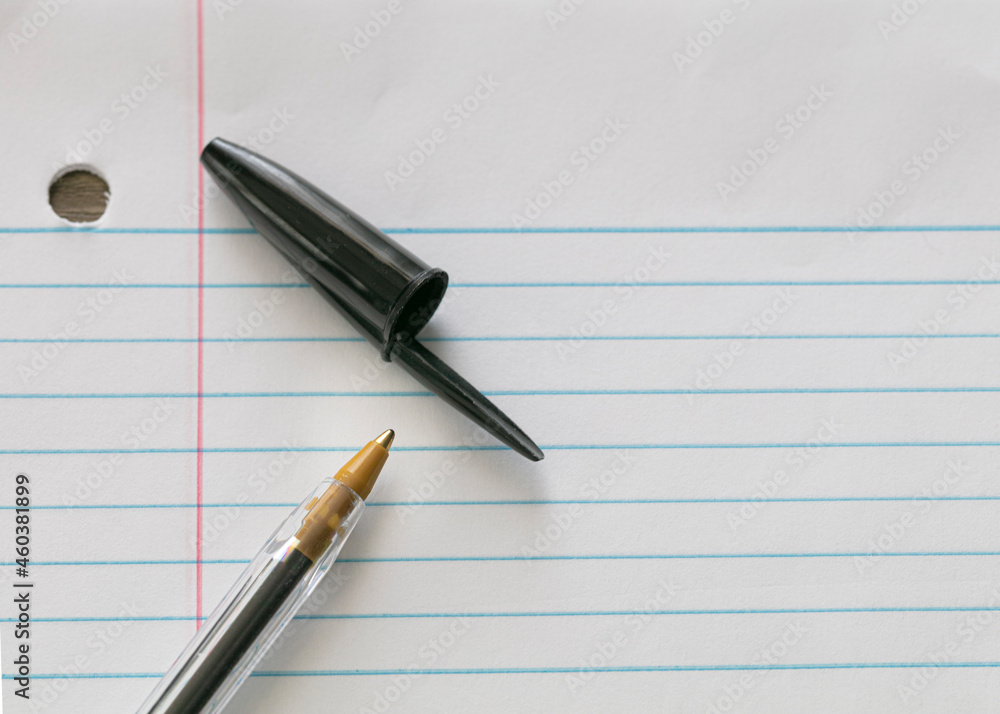classic regular pen with black ink on white blank paper closeup classic regular pen with black ink on white blank paper closeup