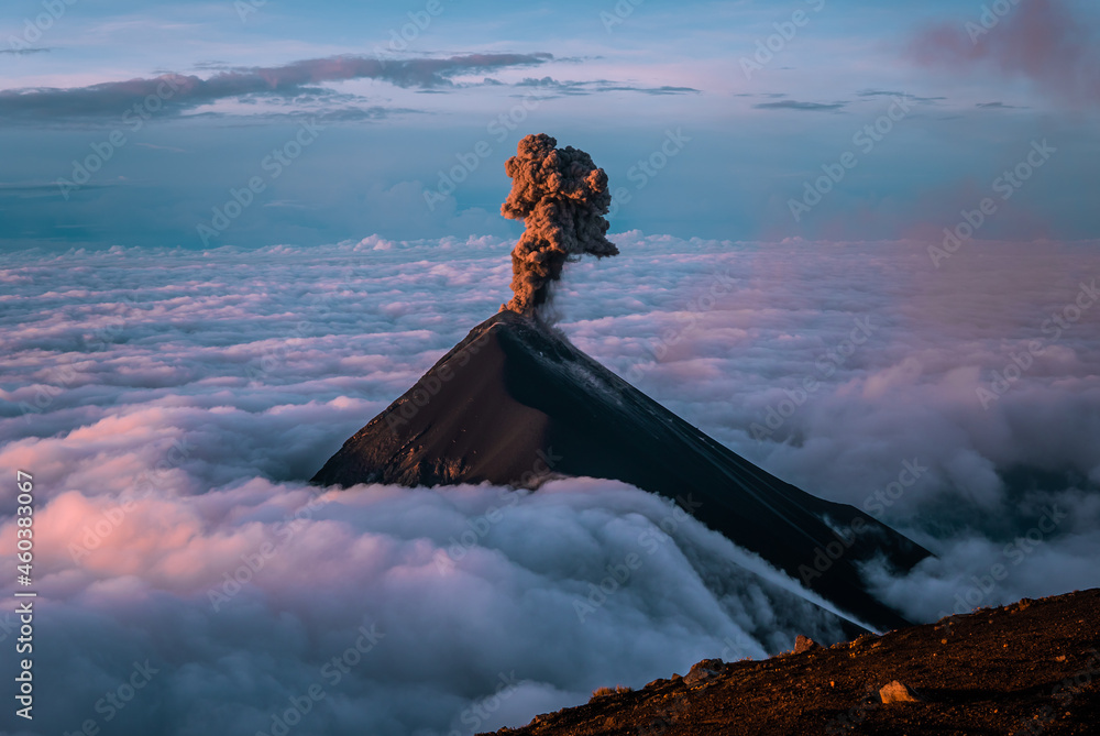 The stunning Volcan de Fuego in Guatemala erupting at sunrise seen from Acatenango Summit - obrazy, fototapety, plakaty 