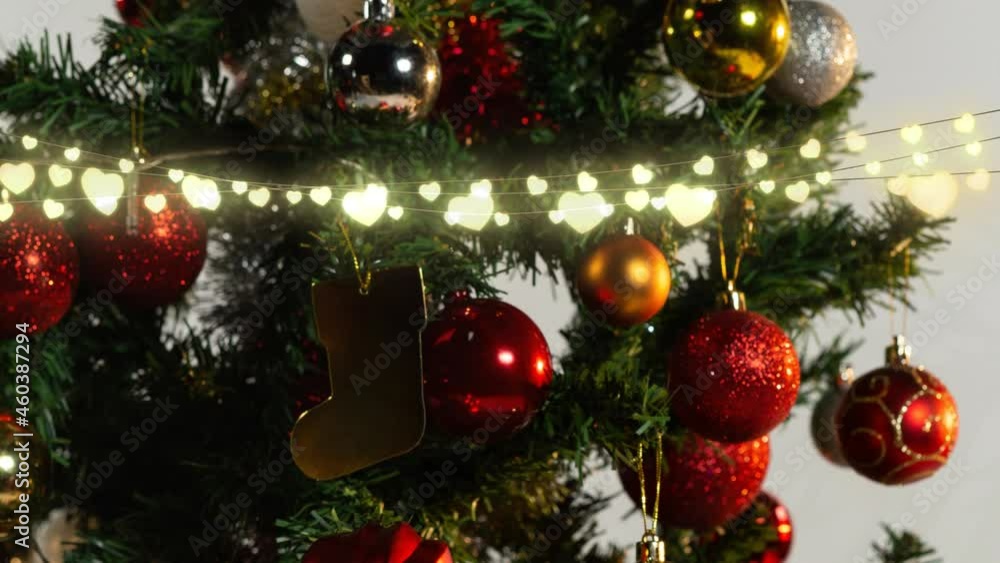 Animation of glowing fairy lights and christmas tree decorations Animation of glowing fairy lights and christmas tree decorations