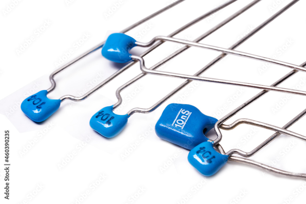 Electronic components: Group of low voltage ceramic capacitors on white background - obrazy, fototapety, plakaty 