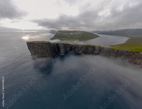 Photography Beautiful aerial view of the Bøsdalafossur waterfall and Trælanípan magnificent