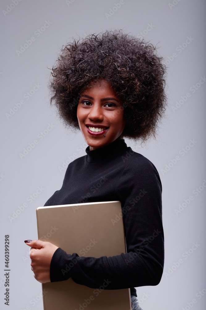 Attractive young Black woman with a lovely friendly smile Attractive young Black woman with a lovely friendly smile