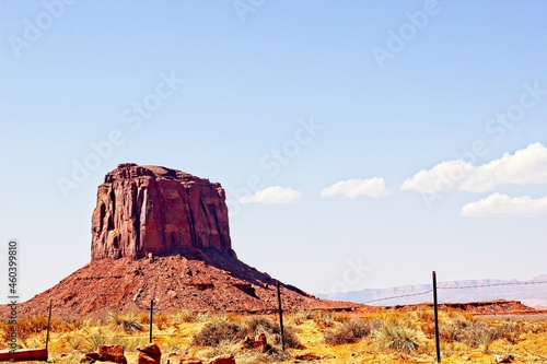 Lone Butte Jutting Above Monument Valley Desert Floor
