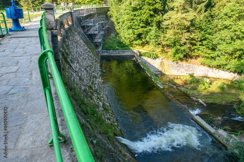 View to Dam on the Lomnica River, semicircular dam with five overflows, on the Lomnica River, in Karpacz, Poland photo