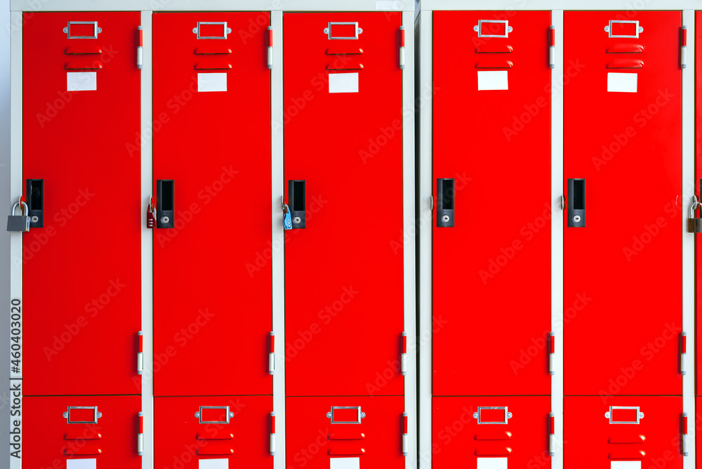 Row of red metal lockers in locker room Row of red metal lockers in locker room