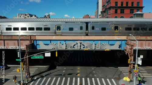 rising over elevated train revealing 125th St. in Harlem