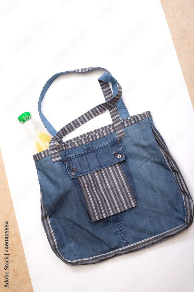 Reusable grocery Eco Bag made of natural fabrics on a white background Reusable grocery Eco Bag made of natural fabrics on a white background