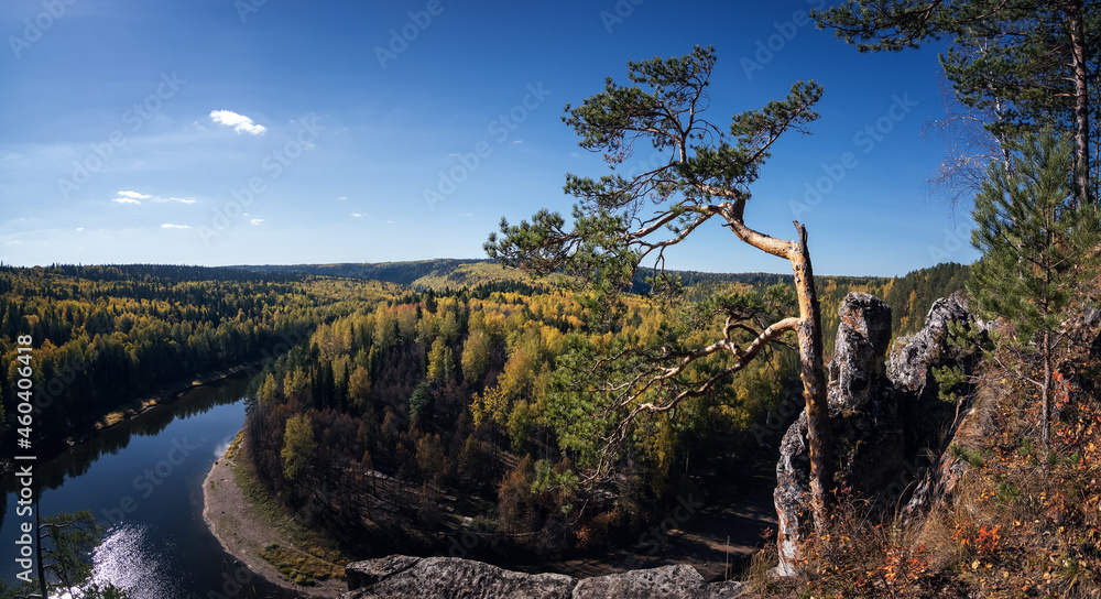 Fototapeta premium Chusovaya River with rocky shores in autumn, Ural, Russia