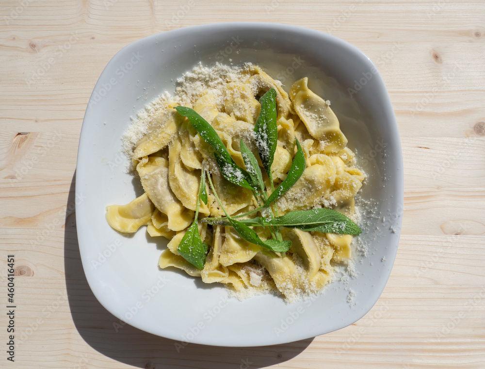 Casoncelli is a kind of ravioli, home made traditional food of the Bergamo area, Italy. Delicious Italian food. Simple food with ancient traditions. Casoncelli cooked served with parmesan cheese Casoncelli is a kind of ravioli, home made traditional food of the Bergamo area, Italy. Delicious Italian food. Simple food with ancient traditions. Casoncelli cooked served with parmesan cheese