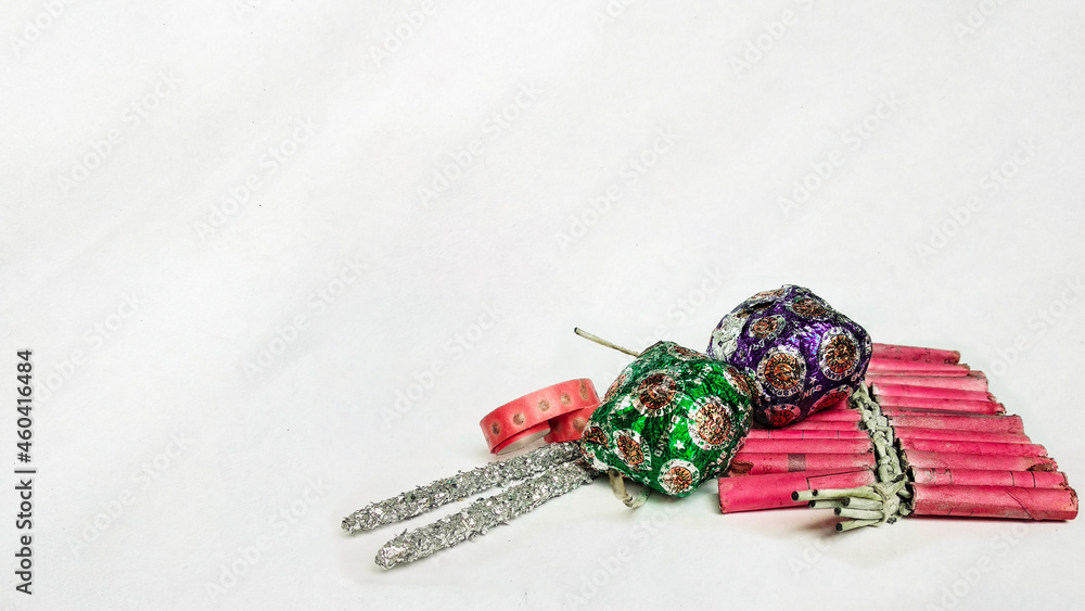 Flat lay image of Diwali festival fireworks or firecrackers on isolated background.