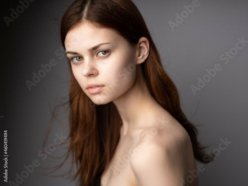 pretty woman hairstyle bare shoulders clear skin fashion dark background