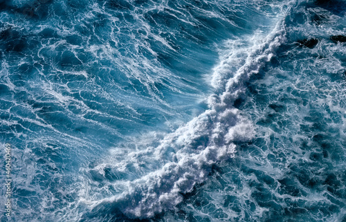 Aerial view to seething waves with foam. Waves of the sea meet each other during high tide and low tide © Dmitry Yakovtsev