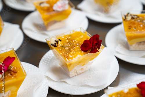 Catering. kremenki with fruit desserts decorated with flowers.  photo