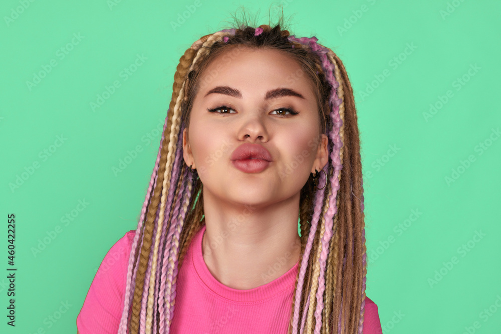 happy young woman with dreadlocks shows kiss happy young woman with dreadlocks shows kiss