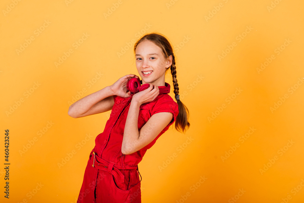 Pretty teenager girl smiling on camera looking cheerful on yellow background. Positive emotions Pretty teenager girl smiling on camera looking cheerful on yellow background. Positive emotions