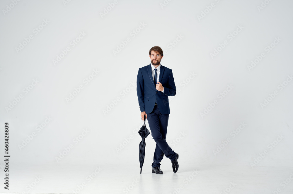 man in suit with umbrella bad weather rain light background man in suit with umbrella bad weather rain light background