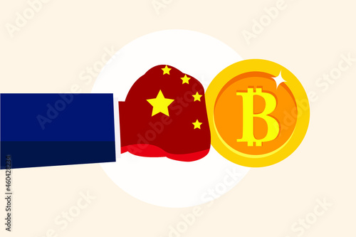 Arm with boxing glove punches Bitcoin. China bans trading and mining Bitcoin