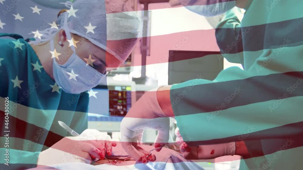 Animation of flag of united states of america waving over surgeons in operating theatre Animation of flag of united states of america waving over surgeons in operating theatre