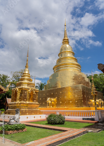 Scenic view of the golden stupas inside compound of famous ancient landmark Wat Phra Singh buddhist temple, Chiang Mai, Thailand