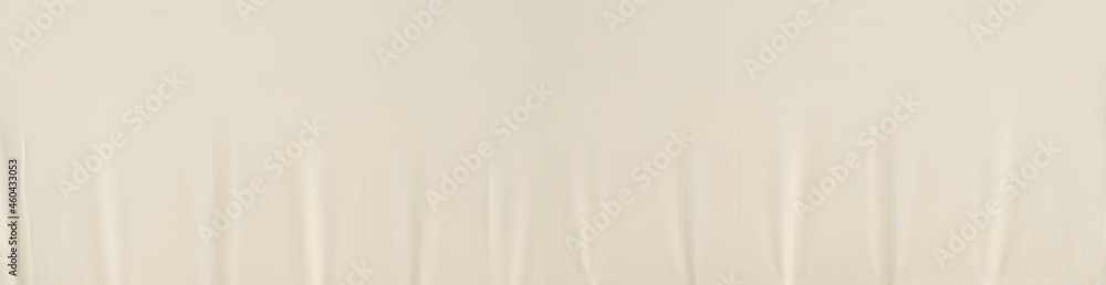 The texture of an artificial fabric light yellow with shadows. Abstract background for wallpaper, design panoramic view The texture of an artificial fabric light yellow with shadows. Abstract background for wallpaper, design panoramic view