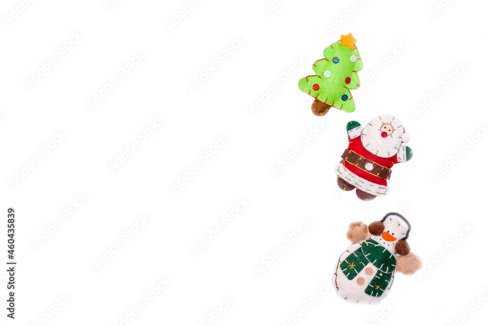 Flat lay santa claus, snowman, felt Christmas toys isolate on a white background. Christmas and New Year concept, place under the text